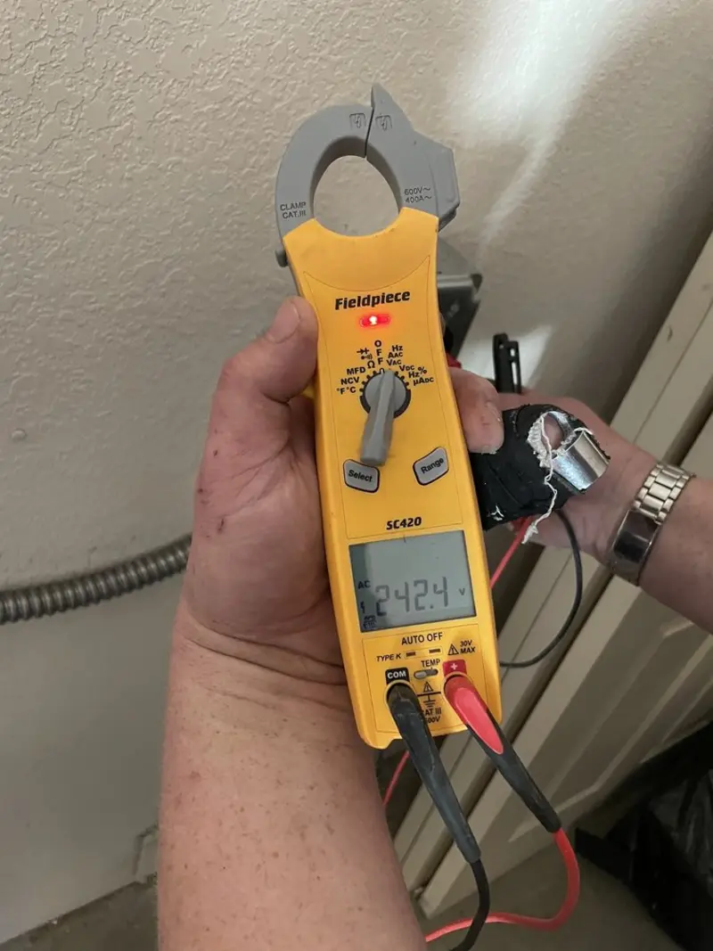 Voltage testing with clamp meter during Circuit Breaker Repair in Glenville